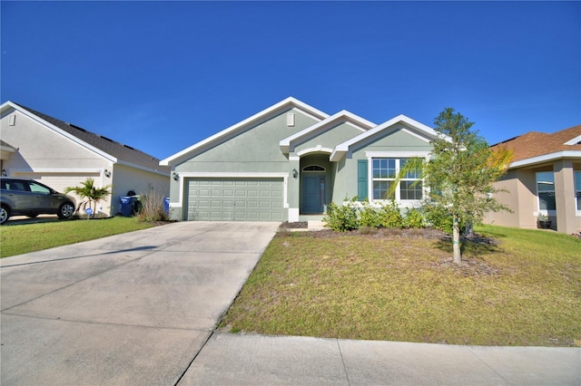 single story home with an attached garage, driveway, a front yard, and stucco siding