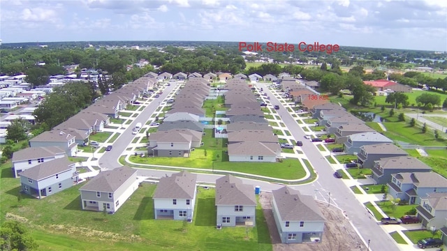 birds eye view of property with a residential view