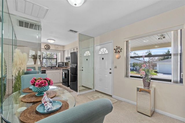 dining space featuring baseboards and visible vents