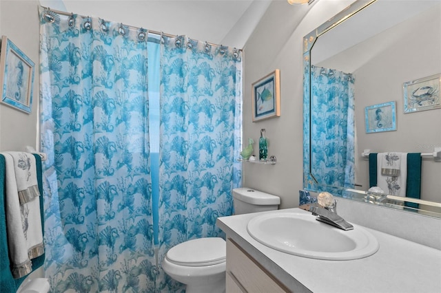 bathroom with a shower with shower curtain, vanity, and toilet