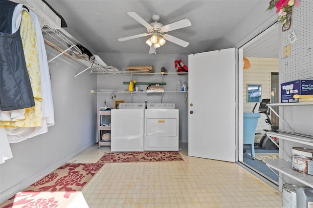 laundry room with washer and clothes dryer, light floors, ceiling fan, a textured ceiling, and laundry area