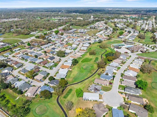 drone / aerial view with a residential view and golf course view