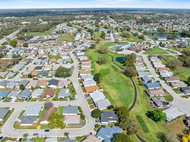 drone / aerial view featuring a residential view and a water view