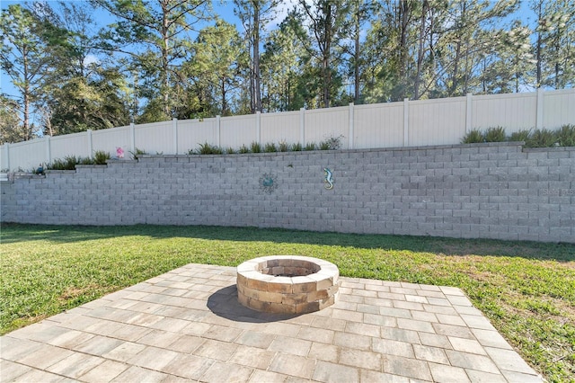 6769 SE 3rd Loop, Ocala, FL 34472 - fenced backyard with a fire pit and a patio