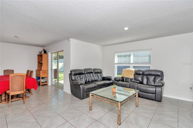 6769 SE 3rd Loop, Ocala, FL 34472 - living area with light tile patterned floors and a textured ceiling