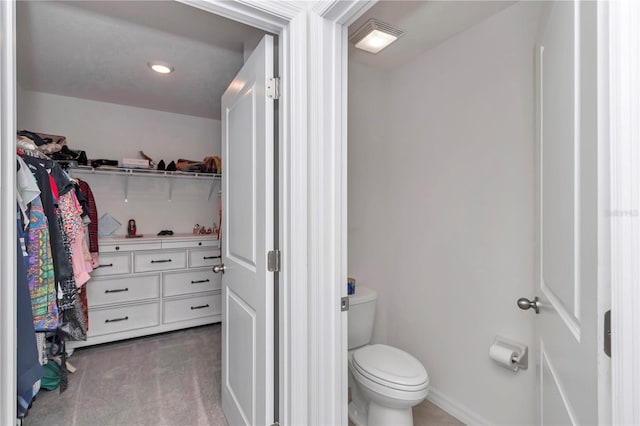 6769 SE 3rd Loop, Ocala, FL 34472 - bathroom featuring a walk in closet and recessed lighting