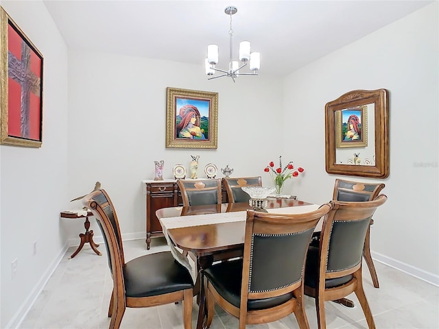 dining room with an inviting chandelier and baseboards