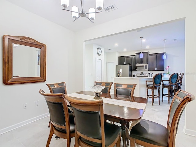 dining area with a notable chandelier, recessed lighting, visible vents, and baseboards