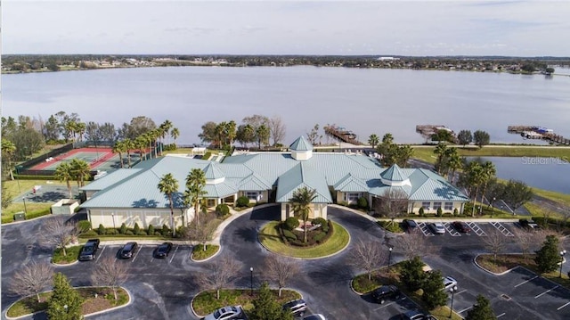 birds eye view of property with a water view