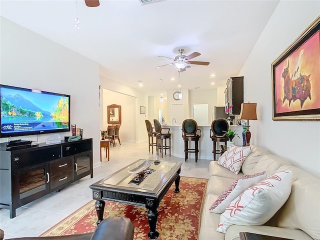 living room featuring visible vents, a ceiling fan, and recessed lighting