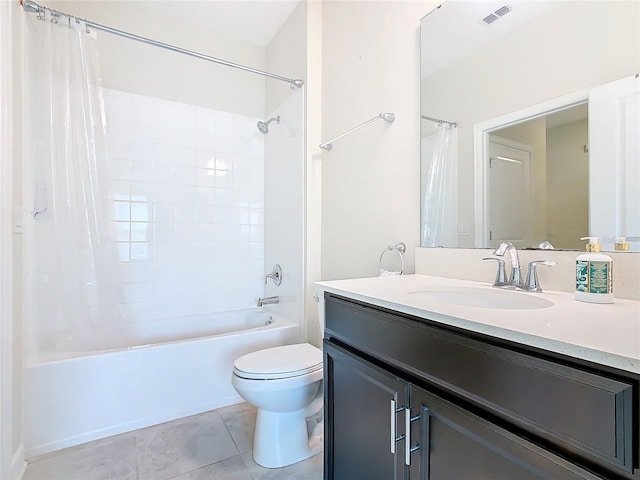 bathroom with toilet, vanity, visible vents, tile patterned floors, and shower / bath combo