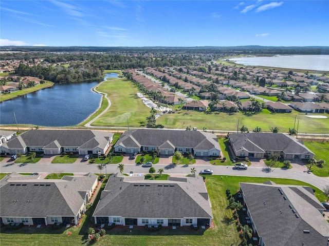 birds eye view of property with a water view and a residential view