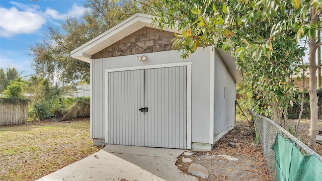 view of shed with fence