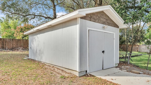 view of shed with fence