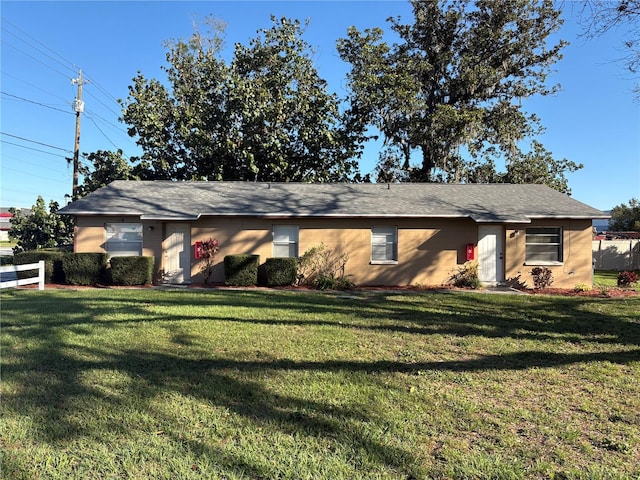 ranch-style home with a front yard