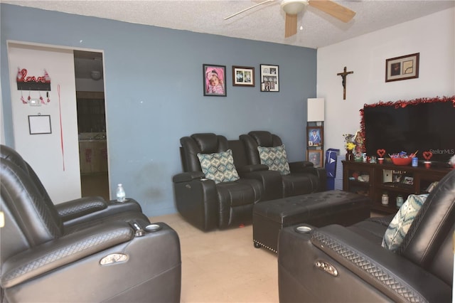 living room featuring a textured ceiling and a ceiling fan