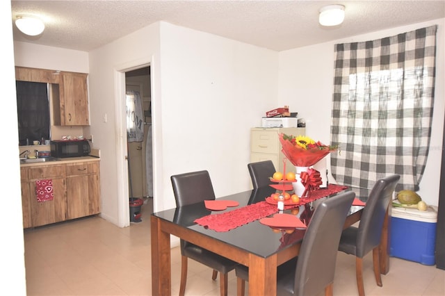 dining area with a textured ceiling