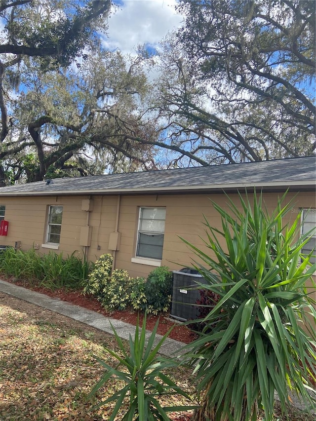 view of property exterior featuring central AC