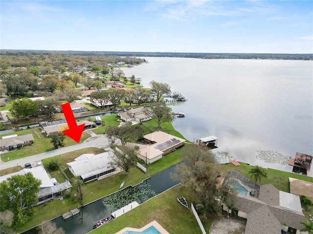 bird's eye view with a water view and a residential view