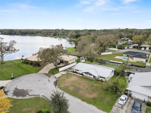 drone / aerial view featuring a water view and a residential view