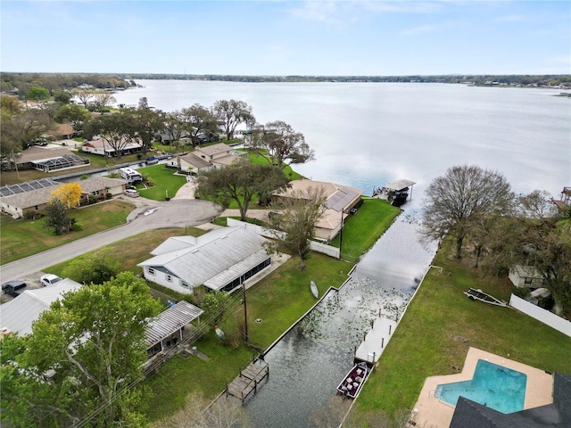 drone / aerial view with a water view and a residential view