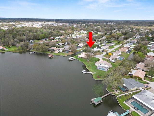 bird's eye view with a water view and a residential view