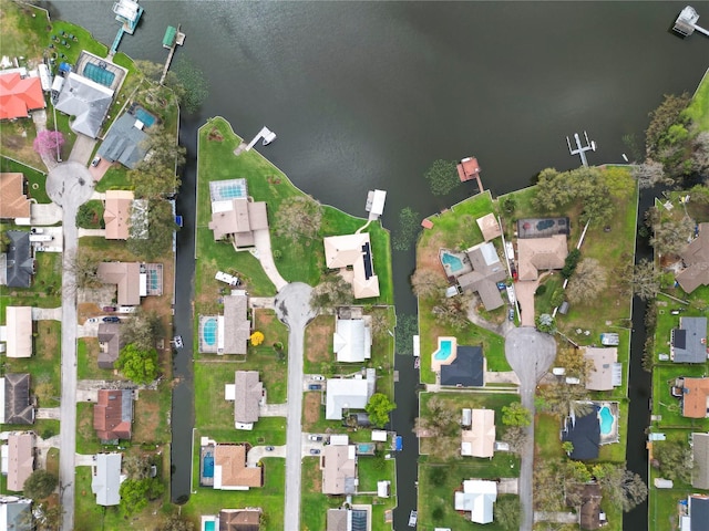 drone / aerial view with a residential view and a water view