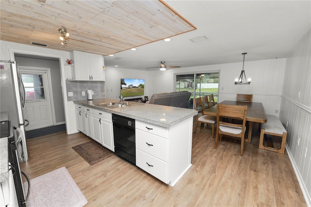 kitchen featuring dishwasher, a sink, white cabinetry, and pendant lighting