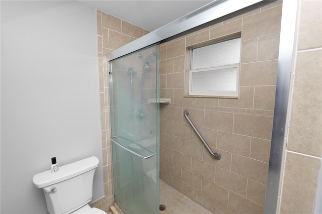 full bath with a stall shower and toilet