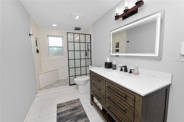 bathroom with tile patterned floors, vanity, toilet, and a walk in shower