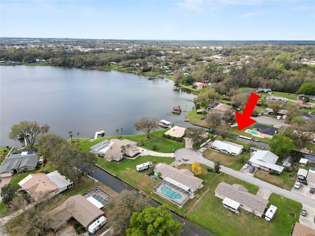 drone / aerial view featuring a water view and a residential view