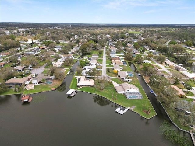 drone / aerial view featuring a water view and a residential view