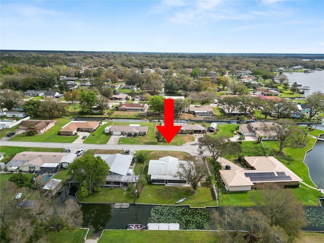 aerial view with a residential view and a water view