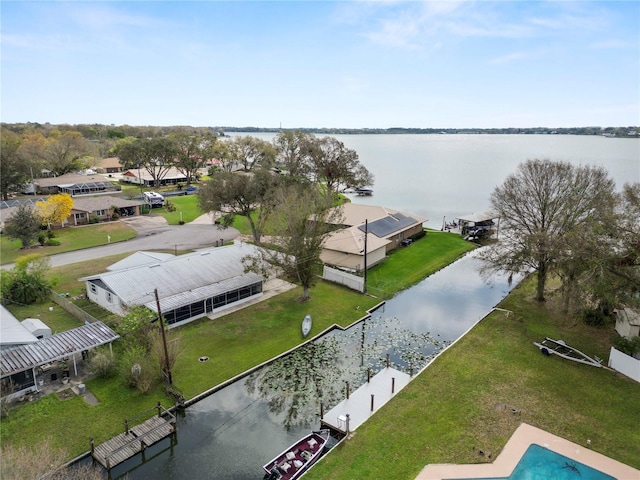 drone / aerial view with a water view and a residential view