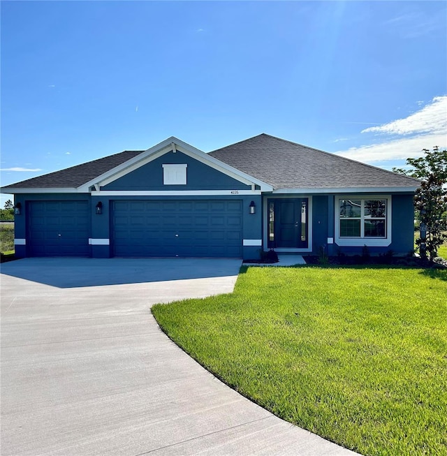 ranch-style home featuring concrete driveway, stucco siding, roof with shingles, an attached garage, and a front yard