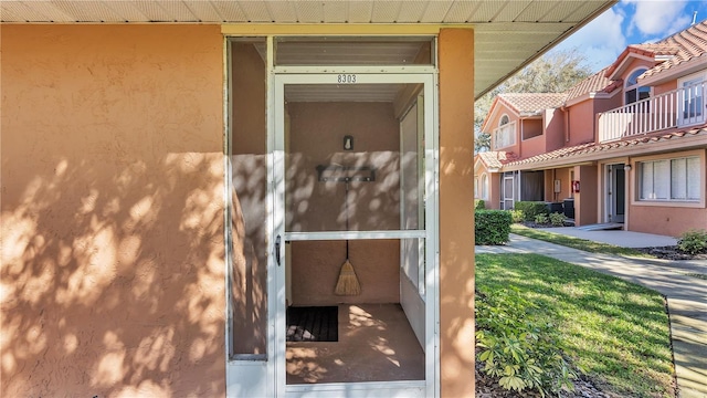 exterior details featuring stucco siding