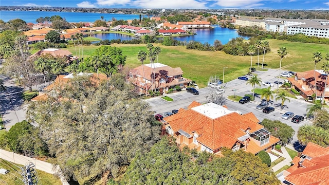 birds eye view of property featuring a water view and a residential view