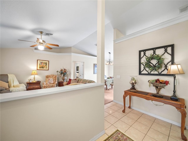 hallway featuring lofted ceiling, light tile patterned flooring, a chandelier, and visible vents