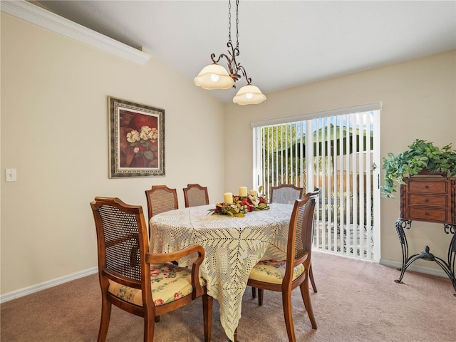 dining room featuring light colored carpet and baseboards