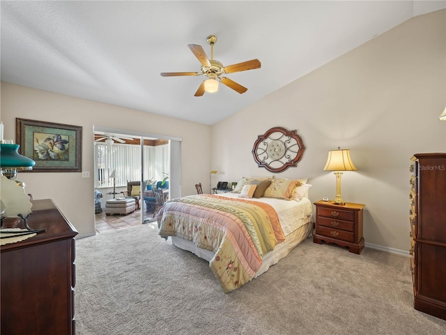 bedroom with access to exterior, lofted ceiling, light colored carpet, and a ceiling fan