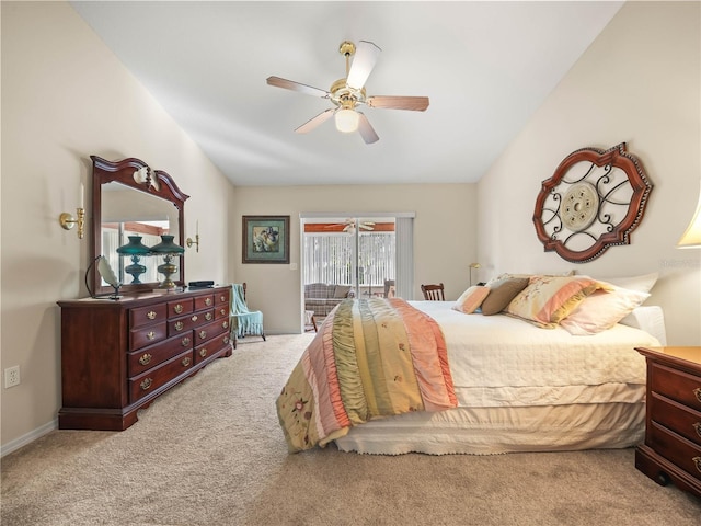 bedroom featuring a ceiling fan, access to outside, light carpet, and vaulted ceiling