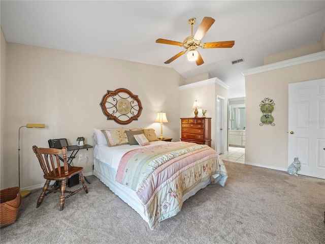 bedroom with baseboards, visible vents, light colored carpet, ornamental molding, and vaulted ceiling