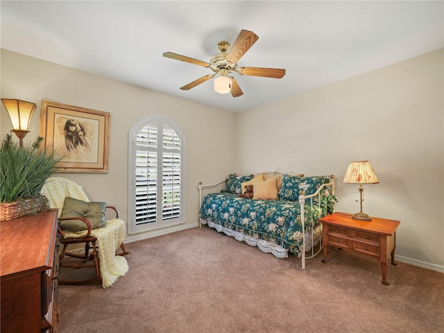 bedroom featuring a ceiling fan, carpet, and baseboards