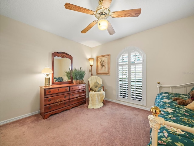 bedroom featuring light carpet, ceiling fan, and baseboards