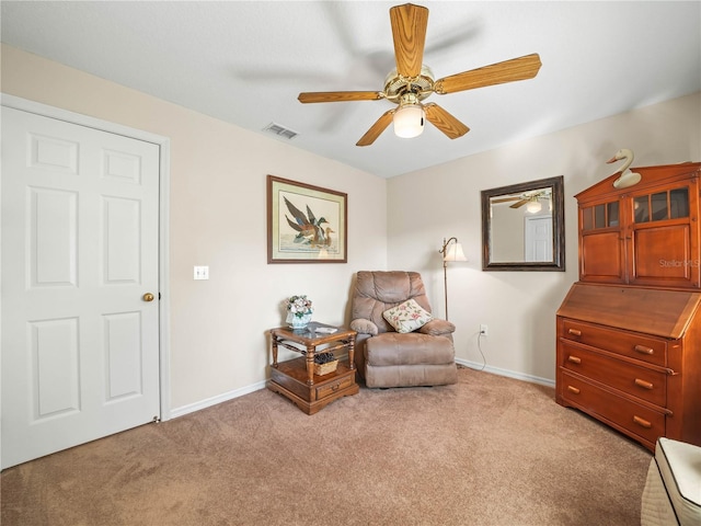 sitting room featuring light carpet, ceiling fan, visible vents, and baseboards