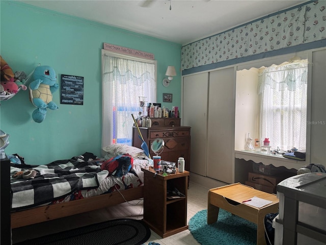 bedroom featuring light wood-style flooring and a closet