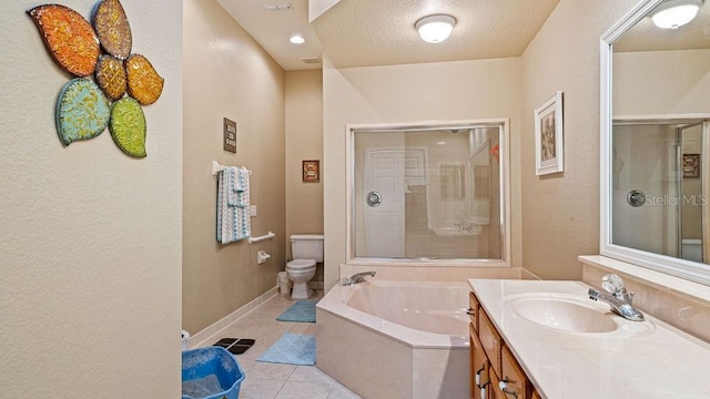 bathroom featuring a garden tub, toilet, a stall shower, vanity, and tile patterned floors