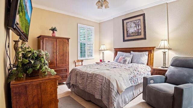 bedroom featuring crown molding and light tile patterned flooring