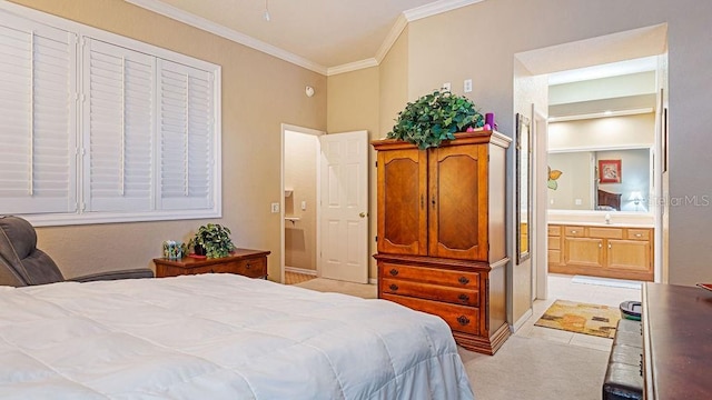 bedroom with connected bathroom, light carpet, and crown molding