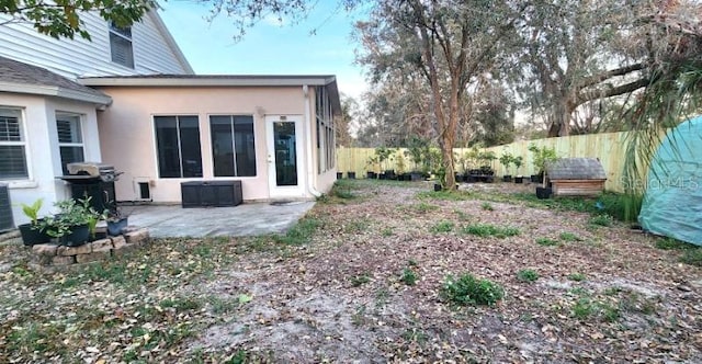 view of yard featuring a patio and a fenced backyard